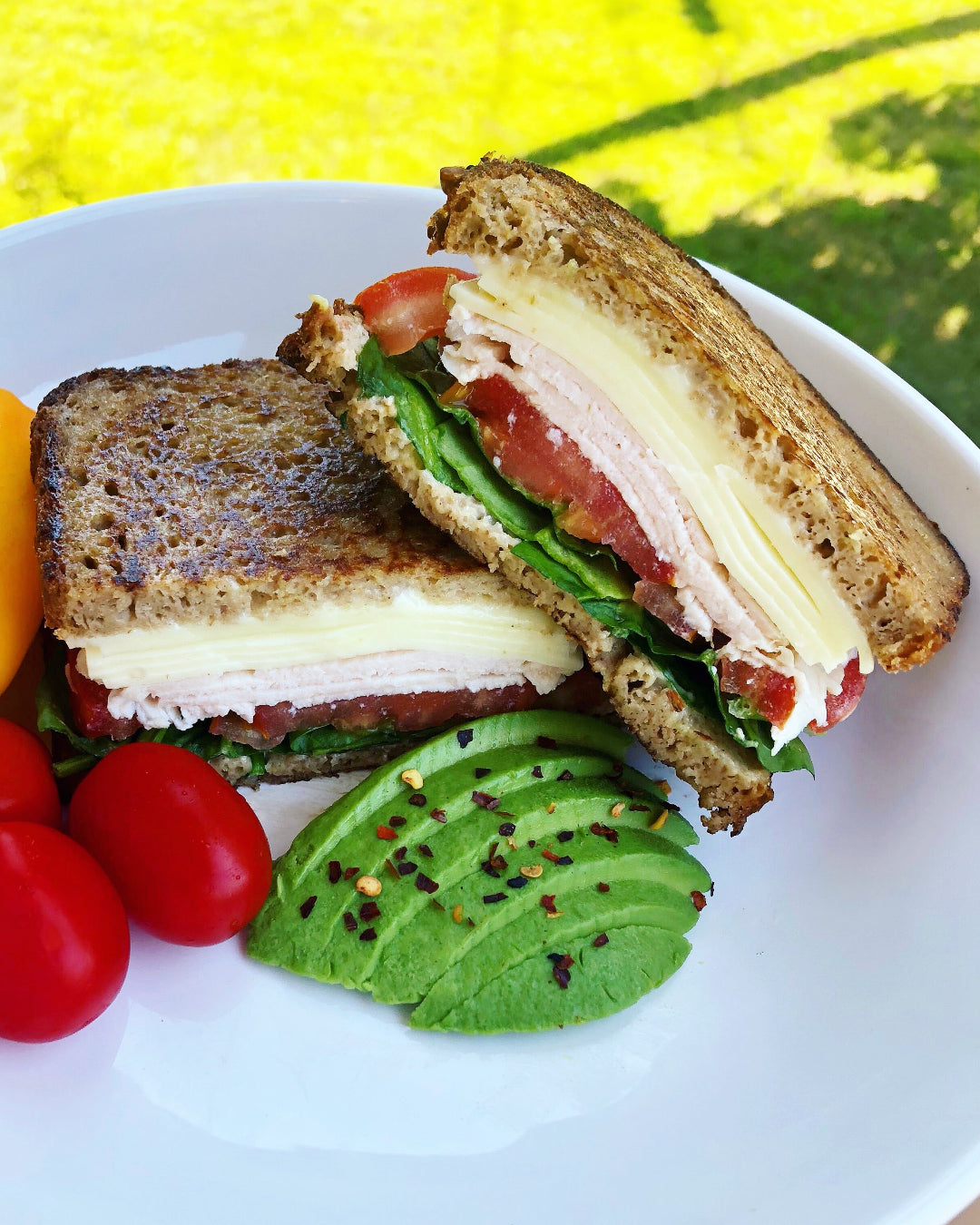 sandwich with vegetables on a white plate